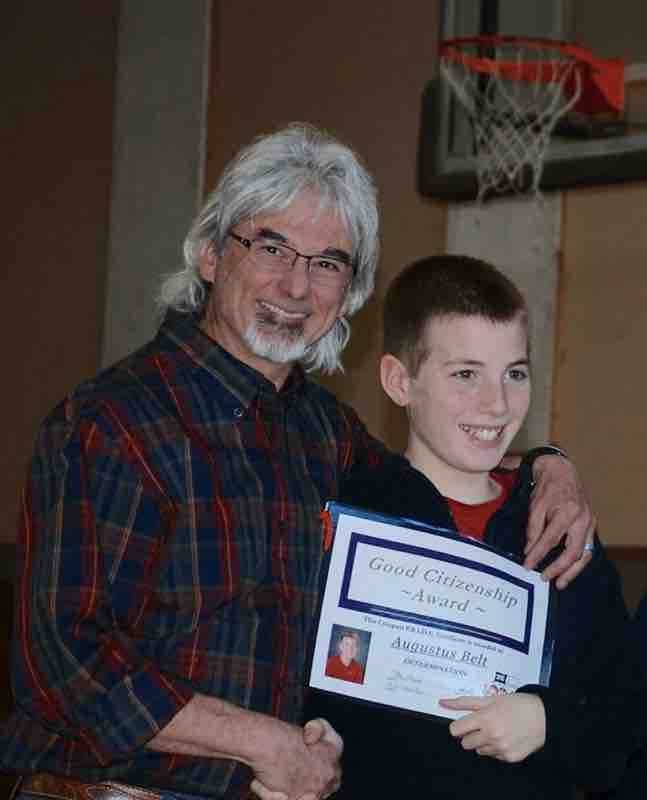 Gus getting an award with his 5th grade teacher