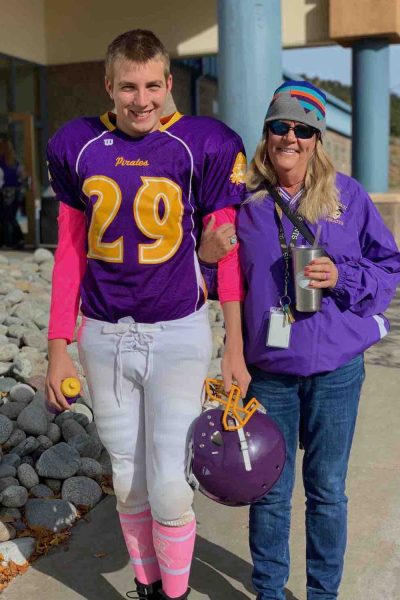 Gus wearing his middle school football uniform